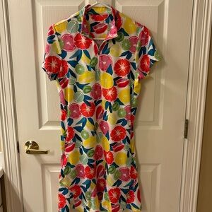 Tail golf dress size Med. Fun colorful print, flounce hemline